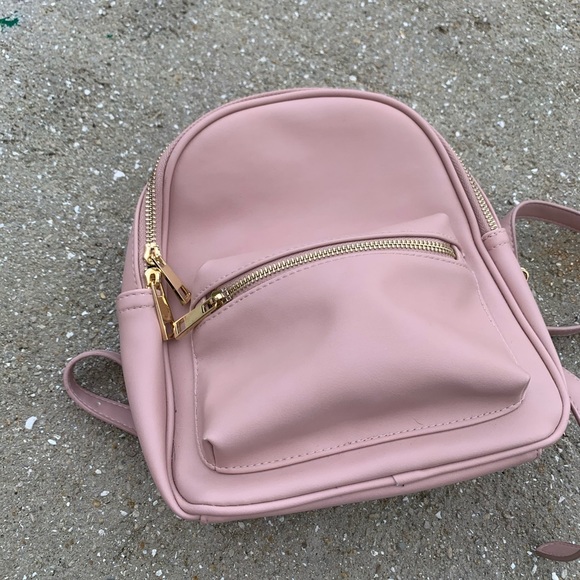 Forever 21 Handbags - Light pink faux-leather small backpack
